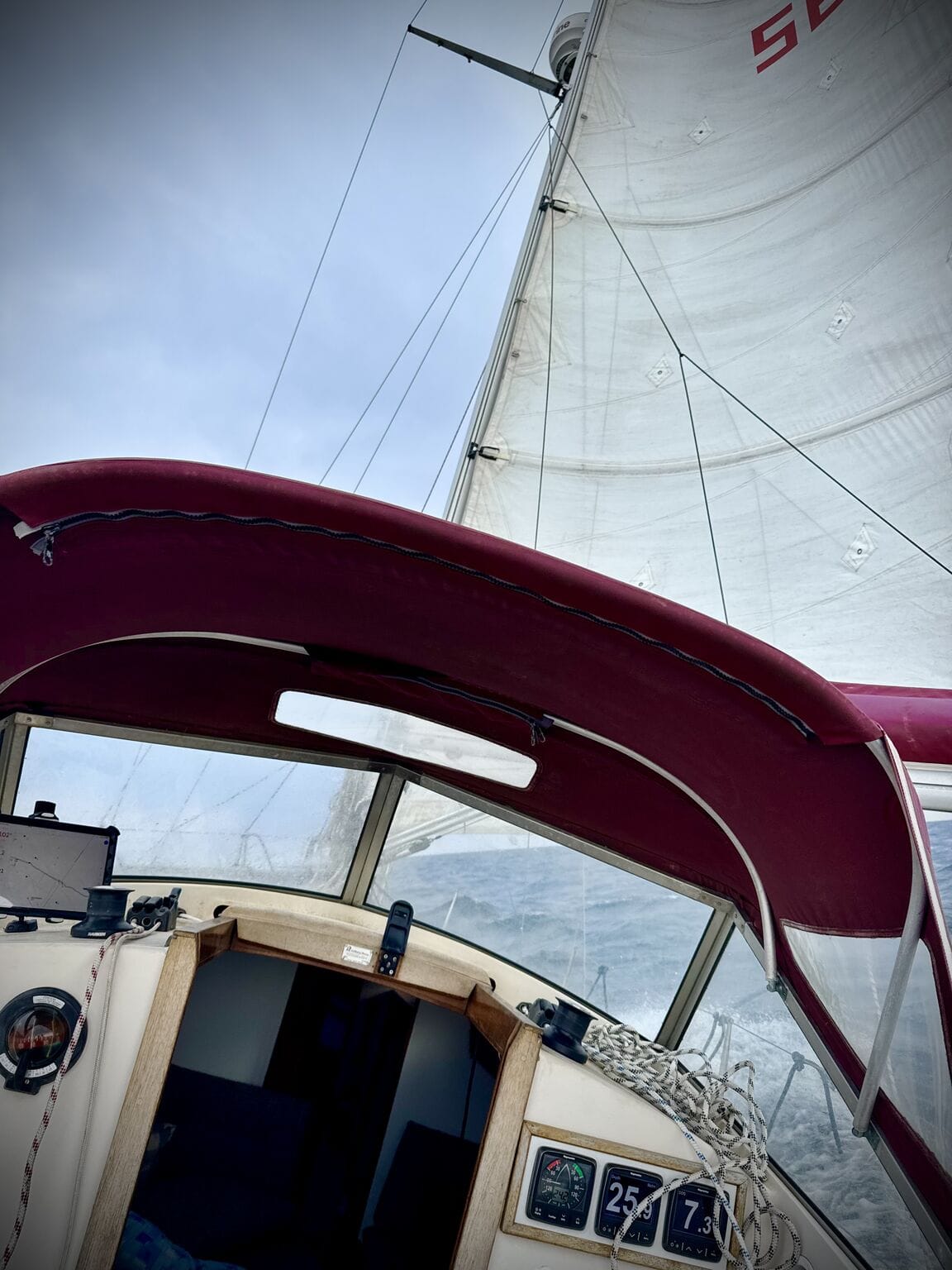 Godiva's cockpit and sprayhood under full sail